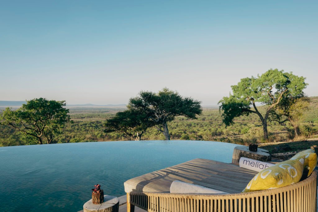 Infinity pool overlooking the Serengeti landscape at Melia Serengeti luxury safari lodge in Tanzania.